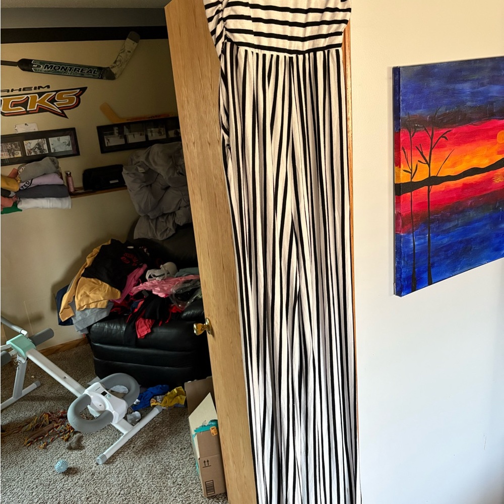 Chic Black and White Striped Jumpsuit with Flowing Design